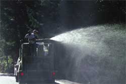 Figure 10.102b - Hydraulic seeders are equipped with several types of nozzles. The nozzle shown in photograph (A) shoots long, high pressure, streams while the fan nozzle shown in (B) spreads the slurry out for closer applications.