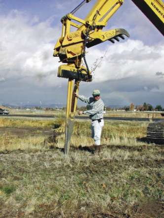 Figure 10.122a - The expandable stinger is operated by placing a long container or hardwood cutting into the chamber (A). The arm of the excavator pushes the point of the stinger into the soil to the appropriate planting depth for the root system (B) and the beak opens, shattering the soil (if it is compacted) and creating a hole (C). The stinger is removed and the plant remains in place as soil collapses around the sides of the plug (D).