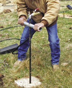 Figure 10.123a - The pot planter creates a planting hole by injecting high pressure water into the soil (A). Once the soil is liquefied, the container is pushed into the soil to the appropriate depth (B).