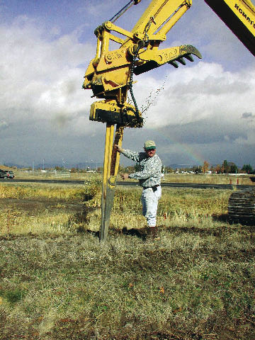 Figure 6.6 - Match stocktypes to outplanting options and equipment available. The expandable stinger (A) is a special planting machinery that attaches to the arm of an excavator. Long-tube stocktypes are placed in the stinger and pushed in the soil (B). The stinger opens and plants the seedling in the soil (C, D). This machinery can reach very steep, rocky slopes that are inaccessible for manual planting.